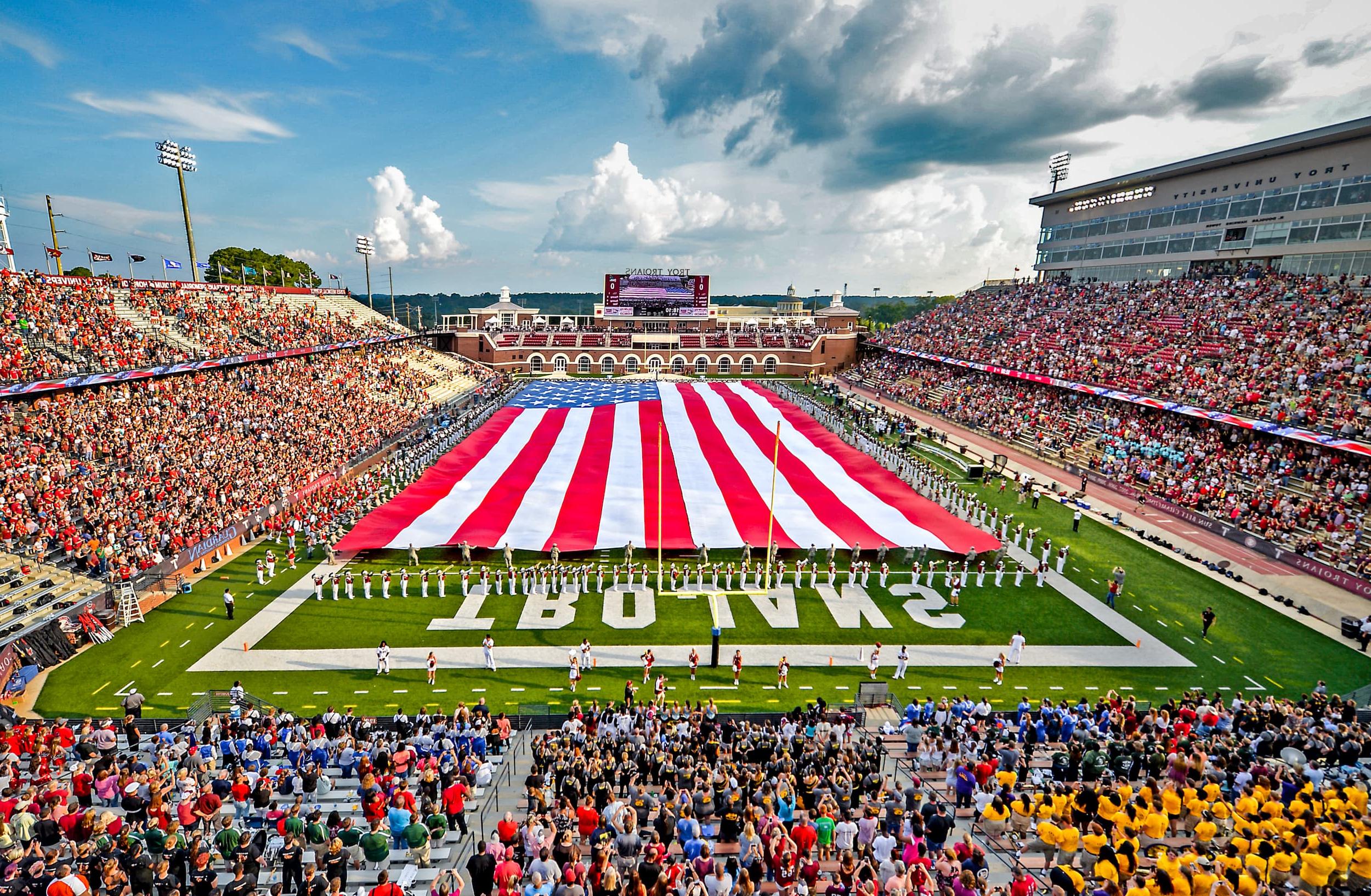 The American Flag covering the field at Veteran Memorial stadium during a TROY football game. 